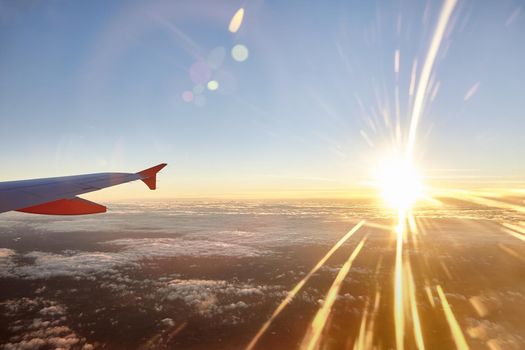 operation departure and landing from the atlantic airport of Nantes with rays light at sunset