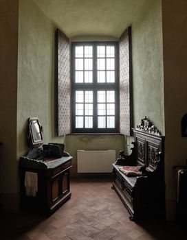 Medieval fortress interior Cabinet with window and wooden brown furniture