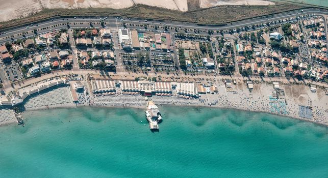 aerial view of (Poetto beach ) seashore of the city of (Cagliari) with salinas field - Sardinia - Italy