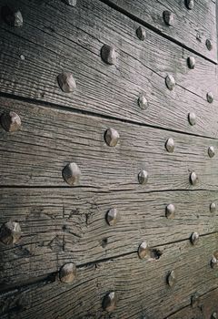 Old medieval door - Close-up of old studded door with multiple studs