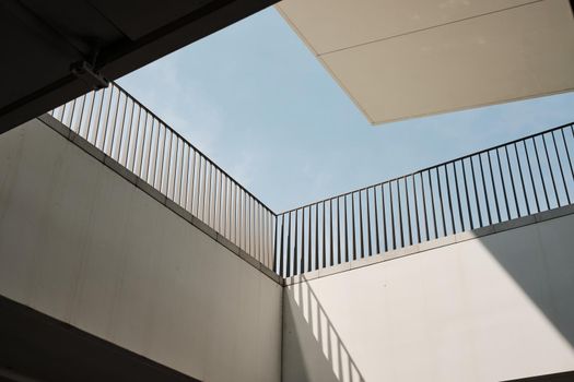 abstract modern architectures balcony detail fence whit blue sky in city life - Milan Italy