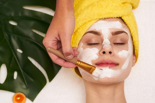 attractive woman with a towel on my head skin care close-up. High quality photo