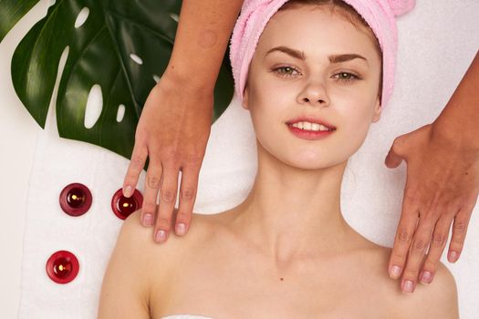 woman with pink towel on her head body care clean skin health. High quality photo