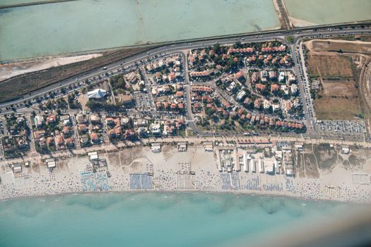 aerial view of (Poetto beach ) seashore of the city of (Cagliari) with salinas field - Sardinia - Italy