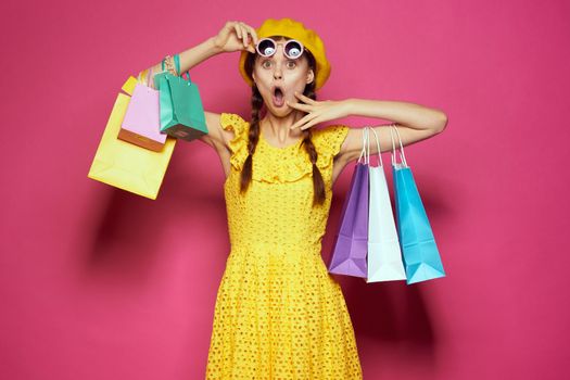 glamorous woman in a yellow hat Shopaholic fashion style isolated background. High quality photo