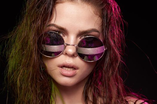 portrait of a woman attractive glance posing sunglasses studio lifestyle. High quality photo