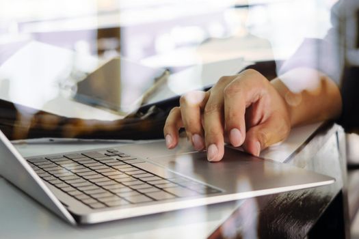 Close up image of Man typing on laptop keyboard