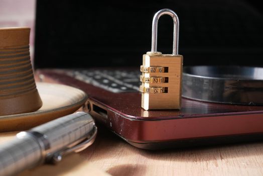 internet safety concept with padlocked on computer keyboard.