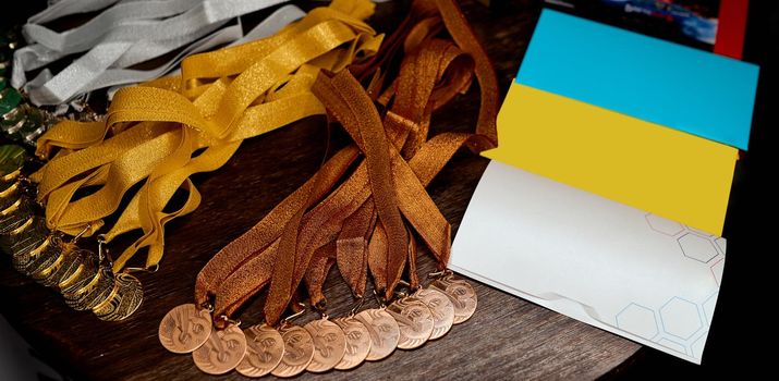 set of prize medals first second third place and envelopes with gifts. High quality photo