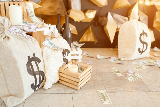 Big Bag Of Money on ground with wood box and future background. High quality photo