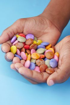 multi-colored sweet candies in a bowl close up .