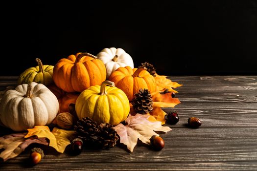 Happy Thanksgiving Day with pumpkin and nut on wooden table