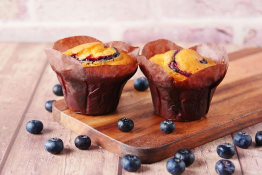 blueberry muffins on table with copy space .