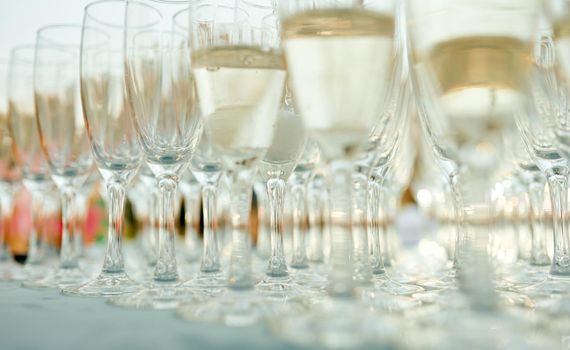 A row of wine glasses on a table. High quality photo