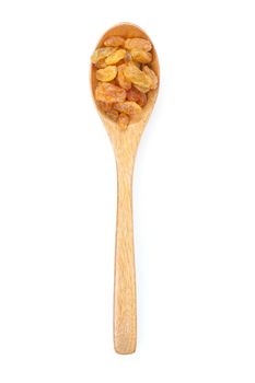 closeup heap of delicious raisins on wooden spoon