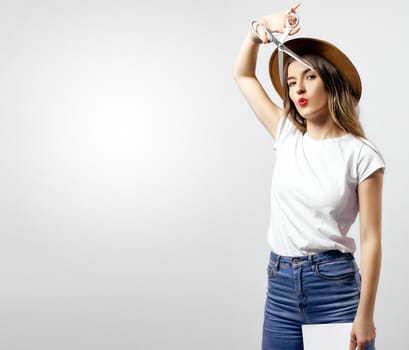 A woman wearing a hat looking through scissors hight quality 