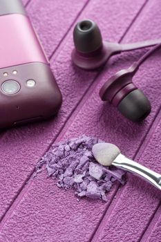 closeup purple cosmetics on purple background