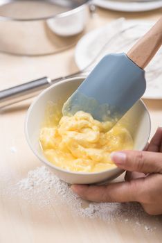 melting creamy butter in the bowl