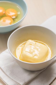 melting creamy butter in the bowl