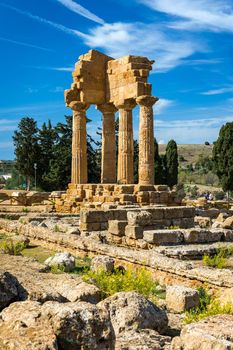 The temple of Castor and Pollux, Dioscuri brothers, panoramic banner image. It has only four columns left, it is symbol of Agrigento. Valley of the Temples in Agrigento, Sicily, Italy.