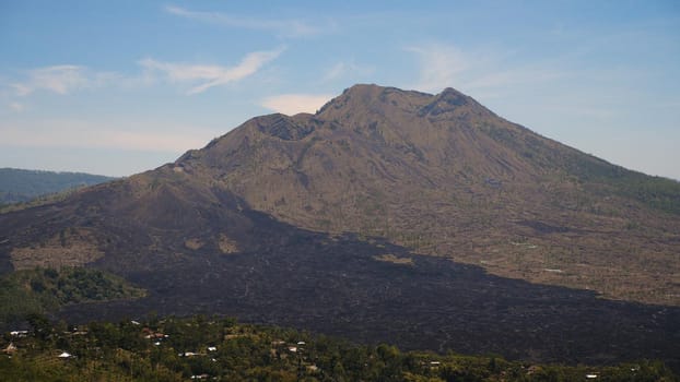 landscape after volcanic eruption volcano Batur mountain landscape with volcano sky and clouds Bali, Indonesia. Travel concept.
