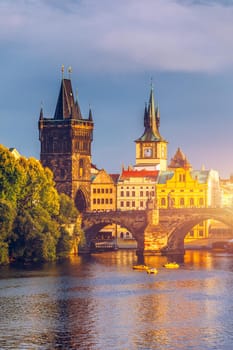 Charles Bridge in Prague in Czechia. Prague, Czech Republic. Charles Bridge (Karluv Most) and Old Town Tower. Vltava River and Charles Bridge. Concept of world travel, sightseeing and tourism.