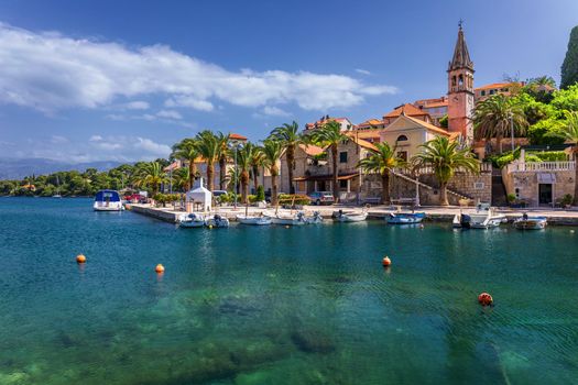 Fishing boats in Splitska village with beautiful port, Brac island, Croatia. Village of Splitska on Brac island seafront view, Dalmatia, Croatia, Croatia.