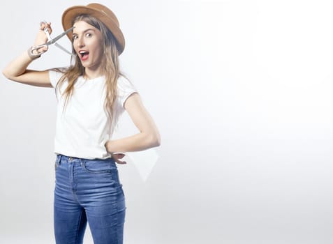 A woman wearing a hat looking through scissors hight quality 