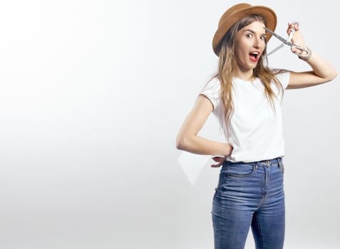 A woman wearing a hat looking through scissors hight quality 