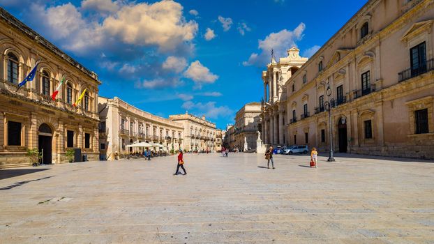 Panorama of Piazza Duomo and of the Cathedral of Syracuse, Sicily, Italy. Baroque cathedral in the historic center of the island, Piazza Duomo of Ortigia in Syracuse, in Sicily, Italy.