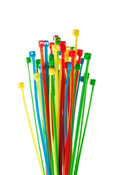 heap of colorful cable ties on white background