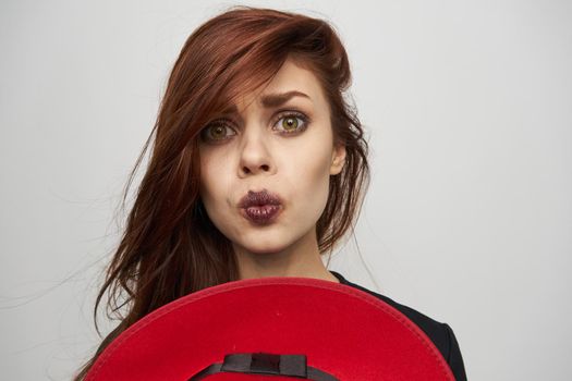 woman with red hat witch posing horror halloween. High quality photo