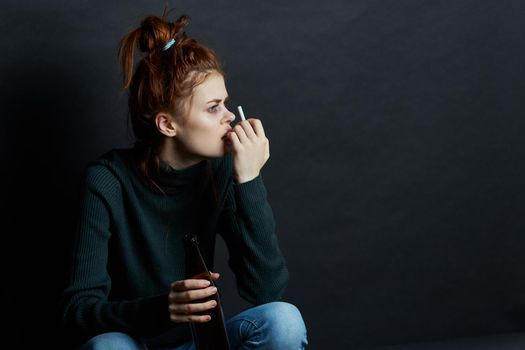 woman with fingal capital smokes a cigarette depression abuse. High quality photo