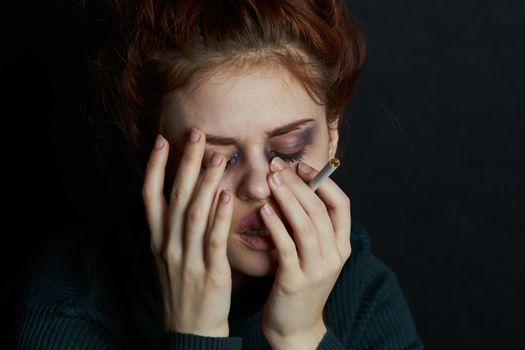 woman with fingal capital smokes a cigarette depression abuse. High quality photo