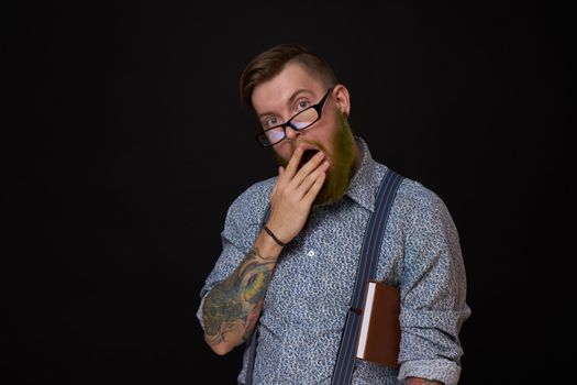 a business man in a shirt with a notebook in the hands of a manager. High quality photo