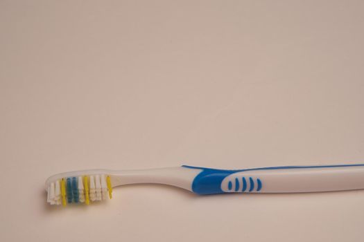 bathroom items hygiene care toothbrush light background. High quality photo