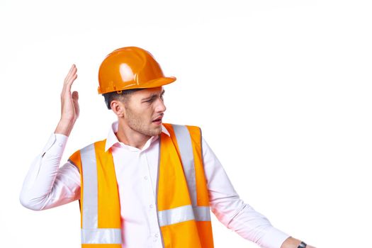 working man in orange uniform posing construction. High quality photo