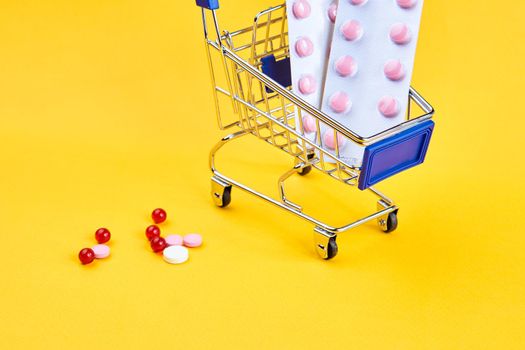 drug trolleys service delivery shopping pharmacy yellow background. High quality photo