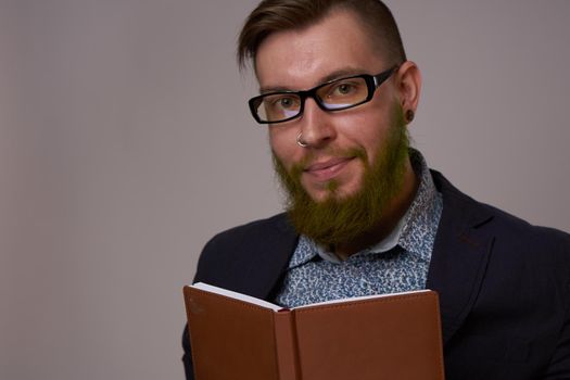 business man with a book in his hands job manager professionals. High quality photo