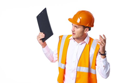 working man in orange uniform posing construction. High quality photo