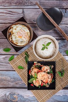 fried herbal vegetables with shrimp  served with steamed rice and fried eggs