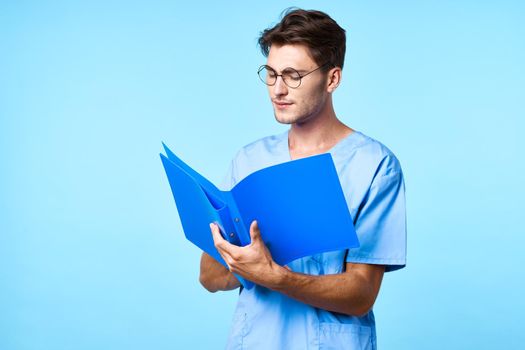 nurse with glasses patient history blue background. High quality photo