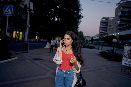 pretty woman with phone in hands communication walk lifestyle. High quality photo