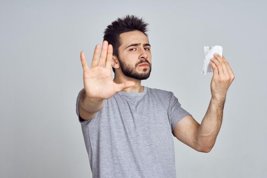 bearded man in white t-shirt posing gesturing with his hands. High quality photo