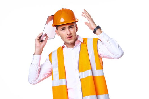 working man in orange uniform posing construction. High quality photo