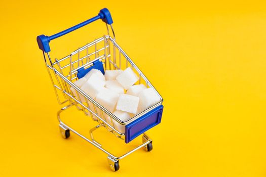 carts with groceries shopping supermarket store yellow background. High quality photo