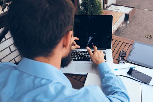 business man working on the street with laptop technology. High quality photo