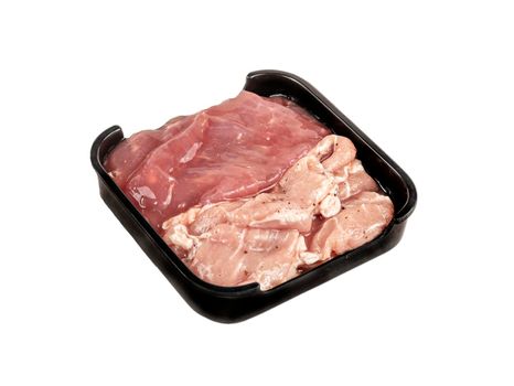 raw pork on plate over white background