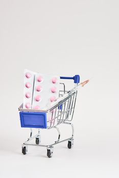 drug trolleys pharmacy shopping light background pharmacy. High quality photo