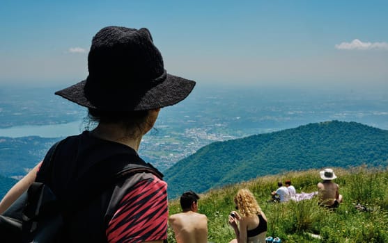 girl or woman looking breathtaking panorama from Palanzone Mountain - como - Lombardy